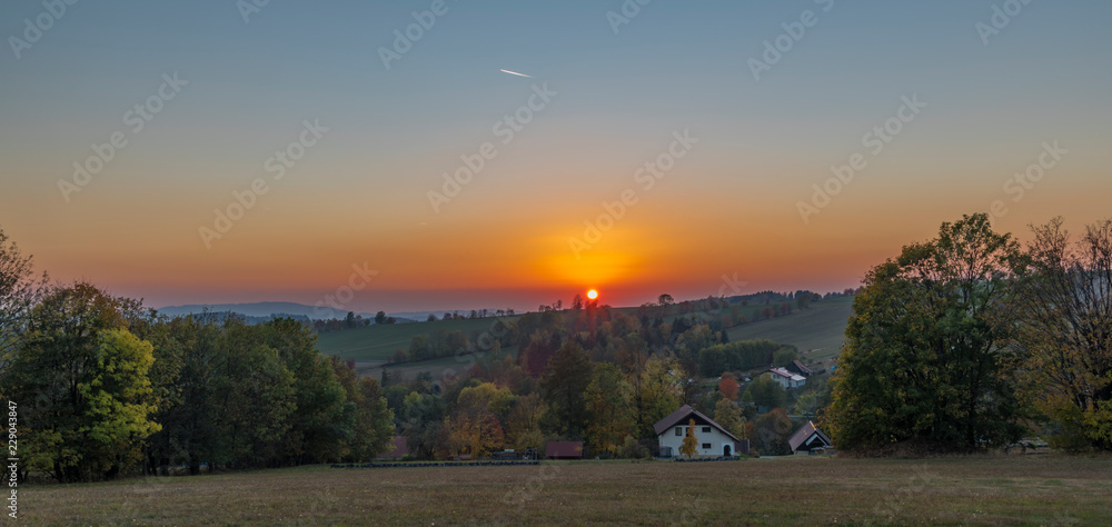 Color dark red orange sunset in Krkonose national park in Roprachtice village