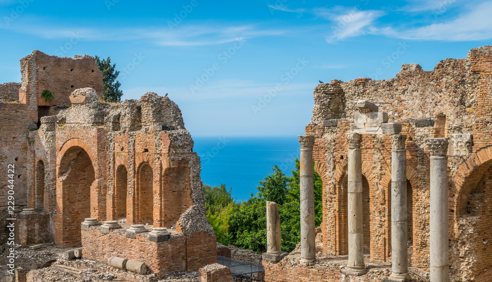 Ruins of the Ancient Greek Theater in Taormina with the sea in the background. Province of Messina, Sicily, southern Italy.