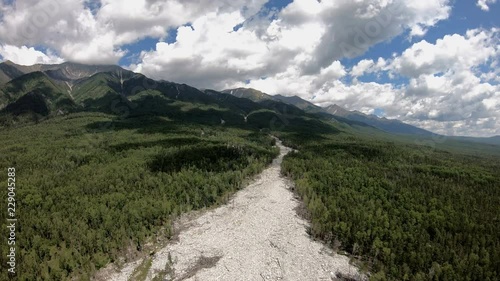 Drone rise up over the river of stones