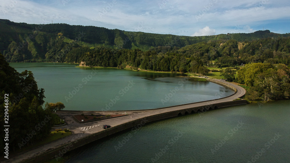Aerial View from a beautiful lagoon surrounded by mountains. Ancient volcano crater. Seven Cities lagoon Azores Islands Portugal Aerial View from a beautiful lagoon surrounded by mountains. Ancient volcano crater. Seven Cities lagoon Azores Islands Portugal