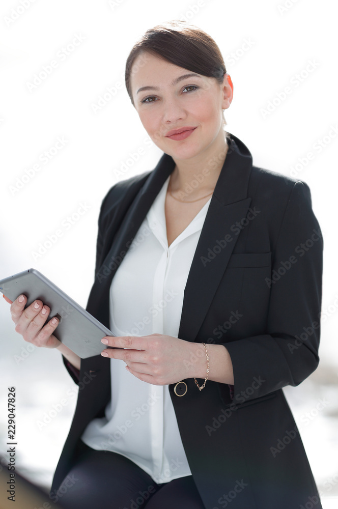 closeup of a successful young business woman with tablet computer closeup of a successful young business woman with tablet computer