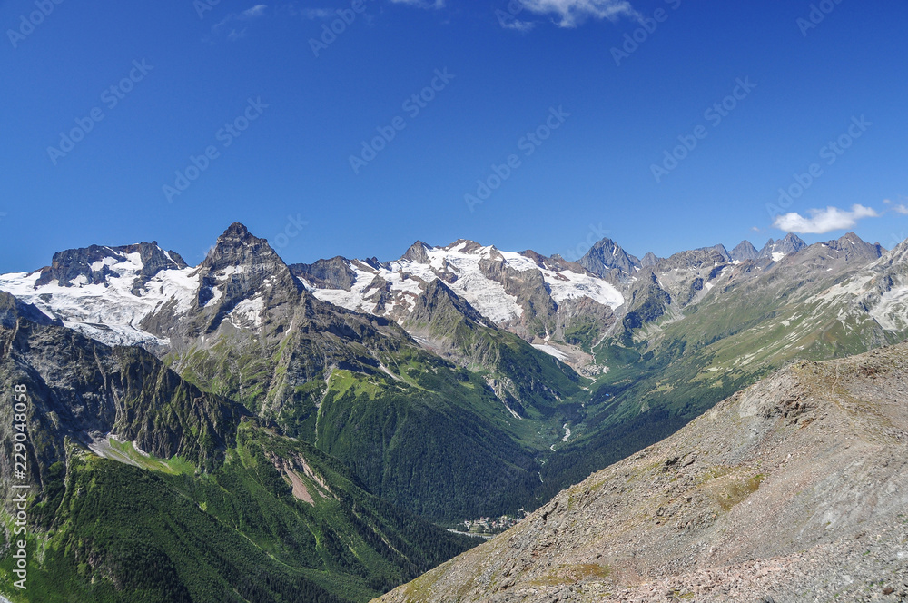 Closeup mountains scenes in national park Dombai, Caucasus, Russia, Europe. Sunshine weather and blue sky, summer day