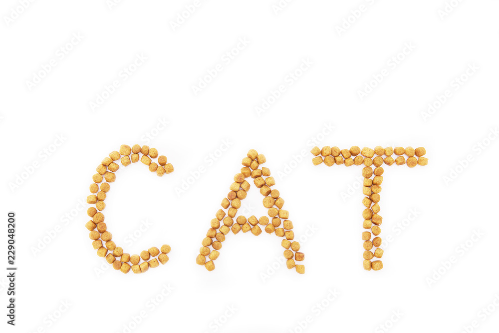 dried pet food in the shape of note cat on white background. Isolated on white
