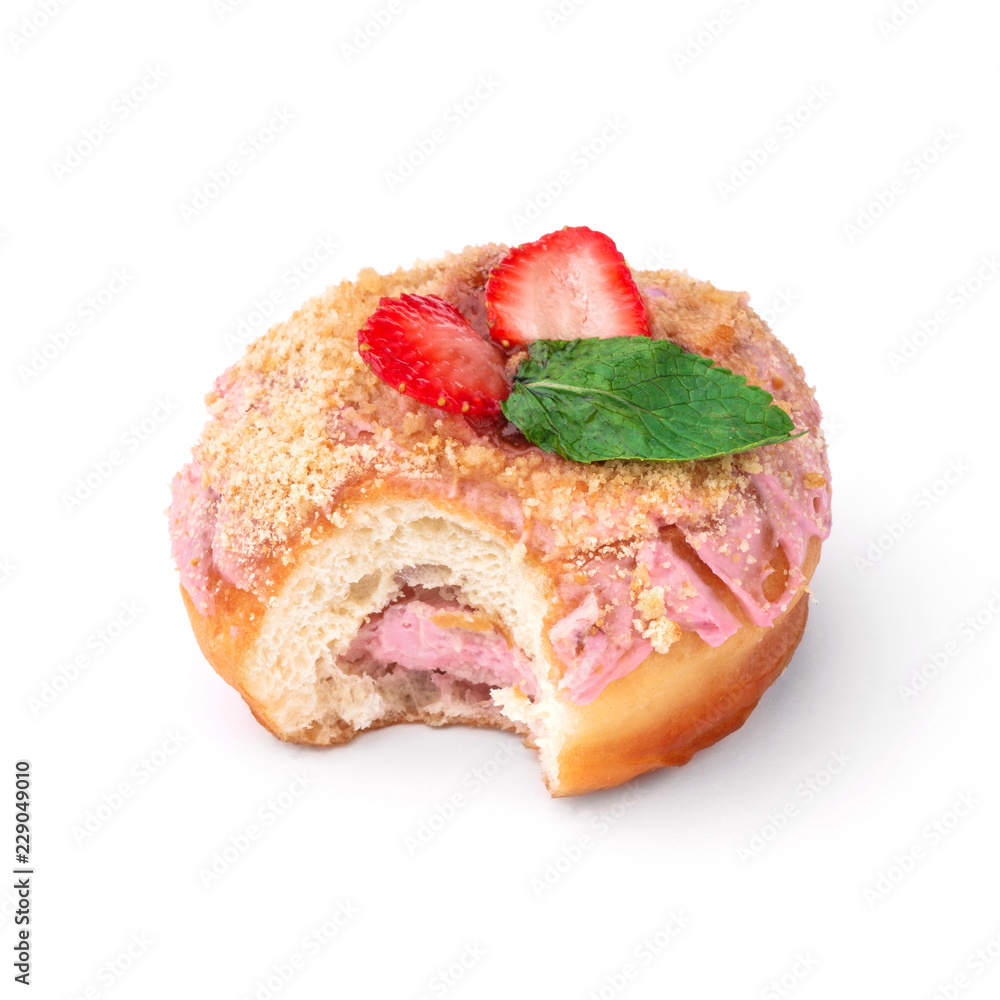Donut with pink cream with nuts and strawberries. View from a forty-five degree angle. Isolated image. The side-bite donut. Donut with pink cream with nuts and strawberries. View from a forty-five degree angle. Isolated image. The side-bite donut.