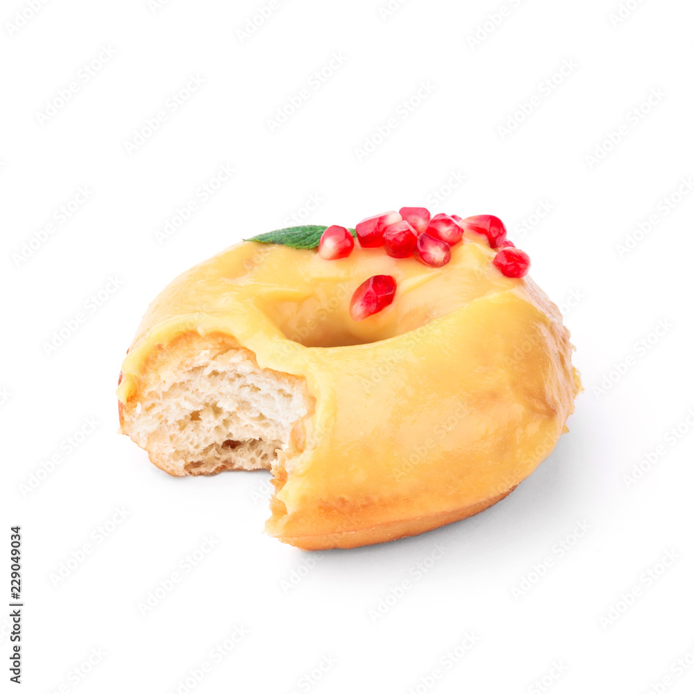 Donut glazed with honey and pomegranate. View from a forty-five degree angle. Isolated image. The side-bite donut. Donut glazed with honey and pomegranate. View from a forty-five degree angle. Isolated image. The side-bite donut.