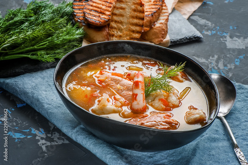 Tableau sur toile French fish soup Bouillabaisse with seafood, salmon fillet, shrimp, rich flavor, delicious dinner