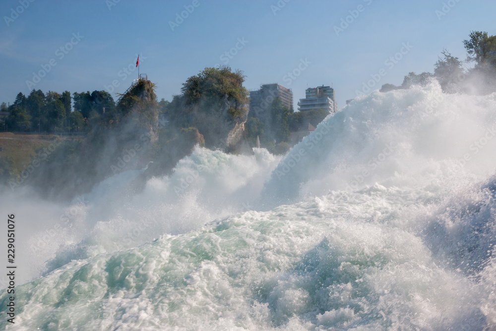 Fototapeta The Rhine Falls is the largest waterfall in Europe in Schaffhausen, Switzerland. Summer day with sun