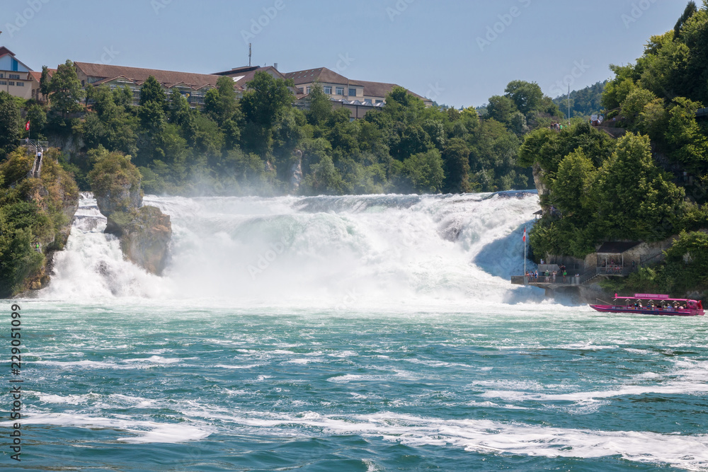 The Rhine Falls is the largest waterfall in Europe in Schaffhausen, Switzerland. Summer day with sun