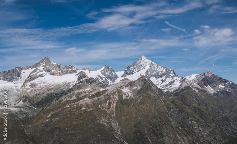 View closeup mountains scenes in national park Zermatt, Switzerland, Europe. Summer landscape, sunshine weather, dramatic blue sky and sunny day