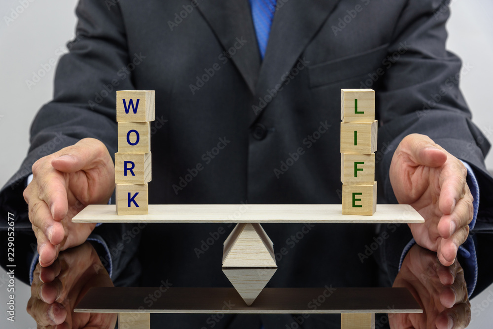 Work life balance concept : Businessman uses his hand protects 2 words ...