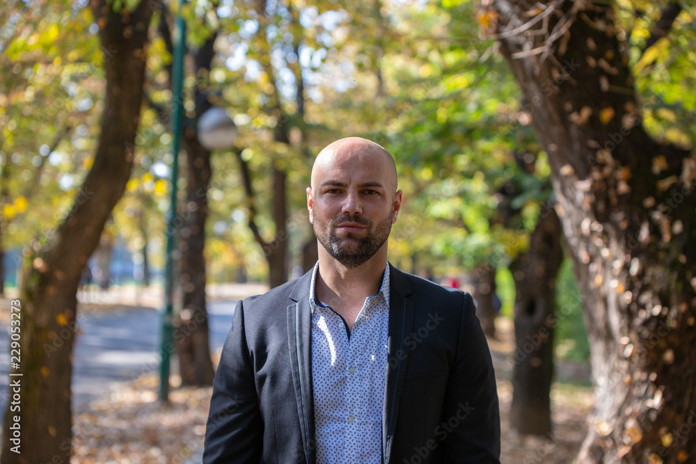Young businessman in park