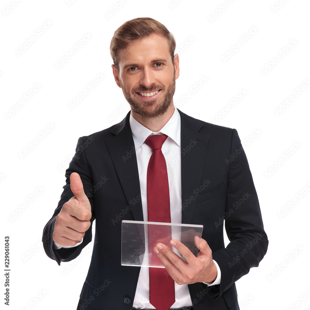 portrait of businessman with futuristic gadget making ok sign portrait of businessman with futuristic gadget making ok sign