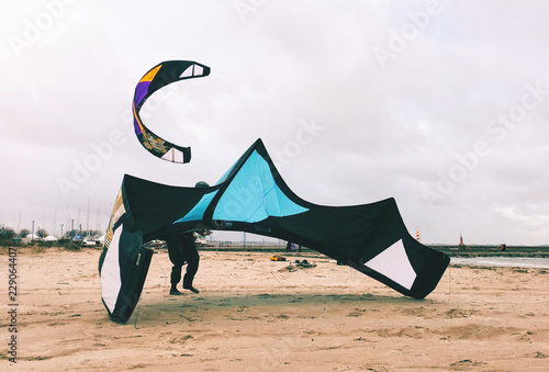 Preparing for kitesurfing at the beach.