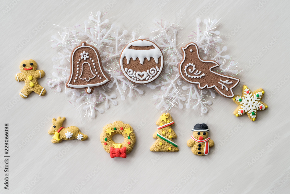 Christmas cookies with new year decorations on wooden table