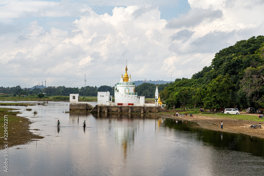 View to the Monastery on Taungthaman Lake from U-bein bridge near Amarapura in Myanmar. 