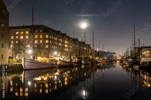 Cozy christianshavn channel in the danish capital of Copenhagen. This is the harbor for many liveaboard and boats made for housing