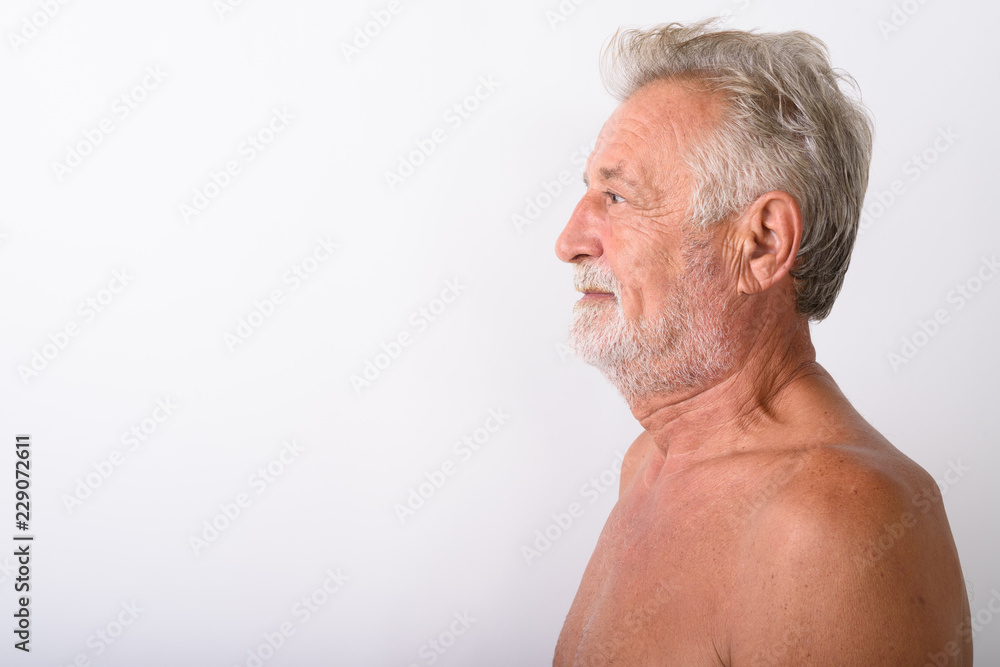 Close up profile view of handsome senior bearded man shirtless Close up profile view of handsome senior bearded man shirtless