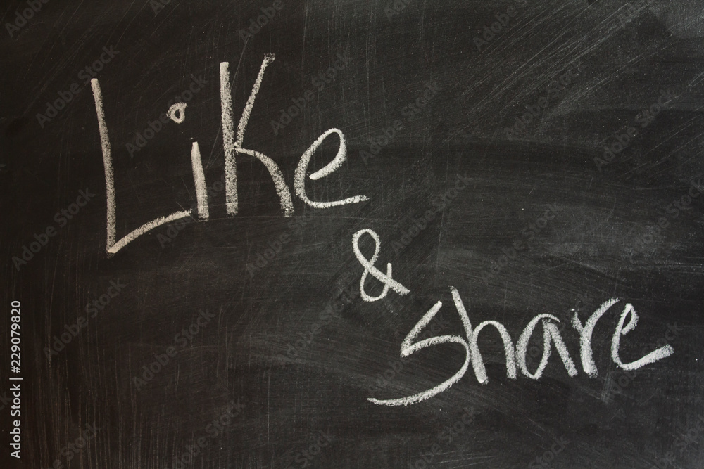 Obraz premium Like and share written on blackboard