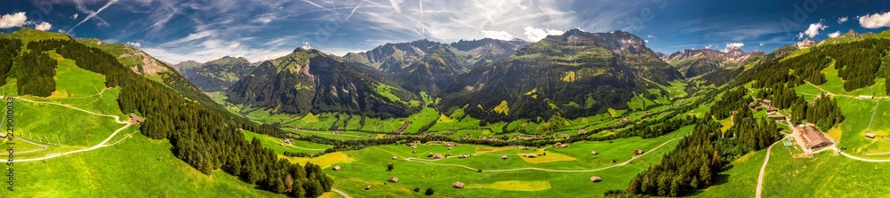 Aerial view of Elm village and Swiss mountains - Piz Segnas, Piz Sardona, Laaxer Stockli from Ampachli, Glarus, Switzerland, Europe