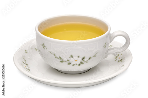 Green tea in cup with leaves on white background including clipping path