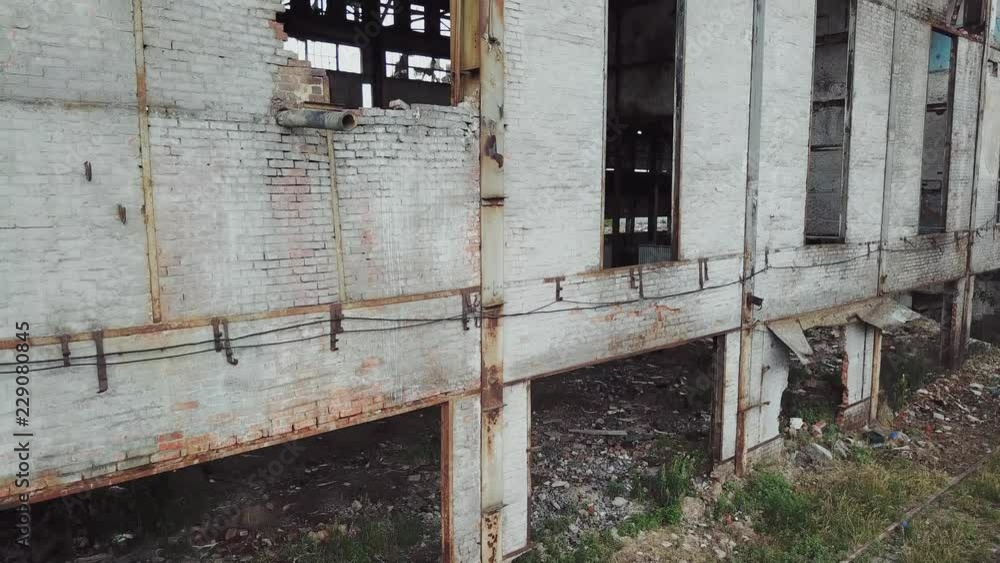 Aerial view of a destroyed factory during the war. Abandoned industrial building. Aerial view of a destroyed factory during the war. Abandoned industrial building.