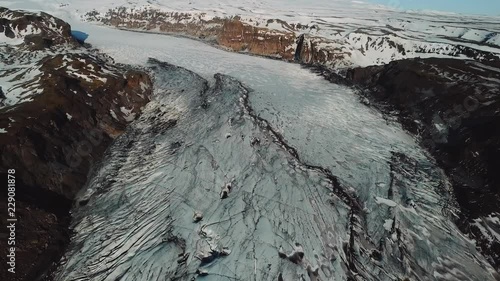 Iceland landscape of glacier Solheimajokull glacier. Beautiful nature aerial drone video of Icelandic nature. Tourist destination and attraction on South Iceland. Glacial lake / lagoon.
