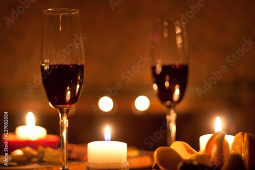 Red wine and candles - romantic evening.