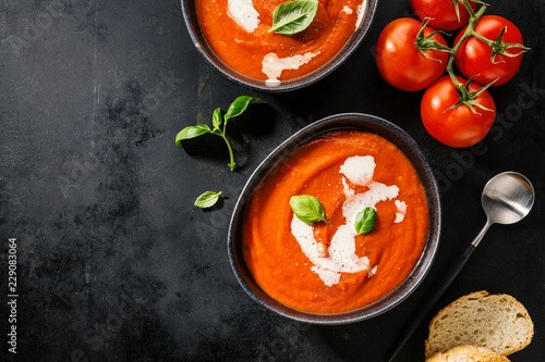 Creamy tomato soup served in bowl