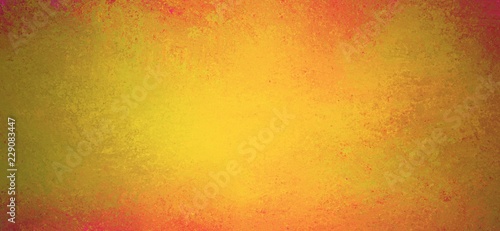 yellow gold background with orange and red grunge border, warm autumn or fall background for Thanksgiving in old vintage painted design