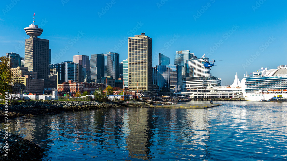 Fototapeta premium Helicopter approaching a cruise ship for a landing.