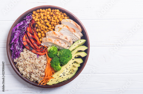 Buddha bowl with avocado , chicken , pepper , quinoa and chickpea