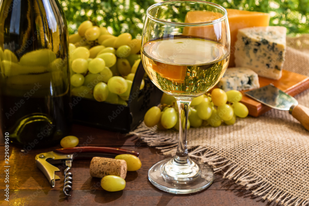 wine table with cheese and grapes