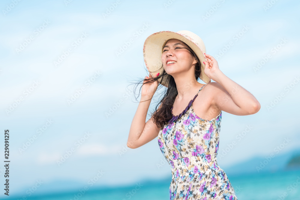 woman enjoying a day at the beach woman enjoying a day at the beach