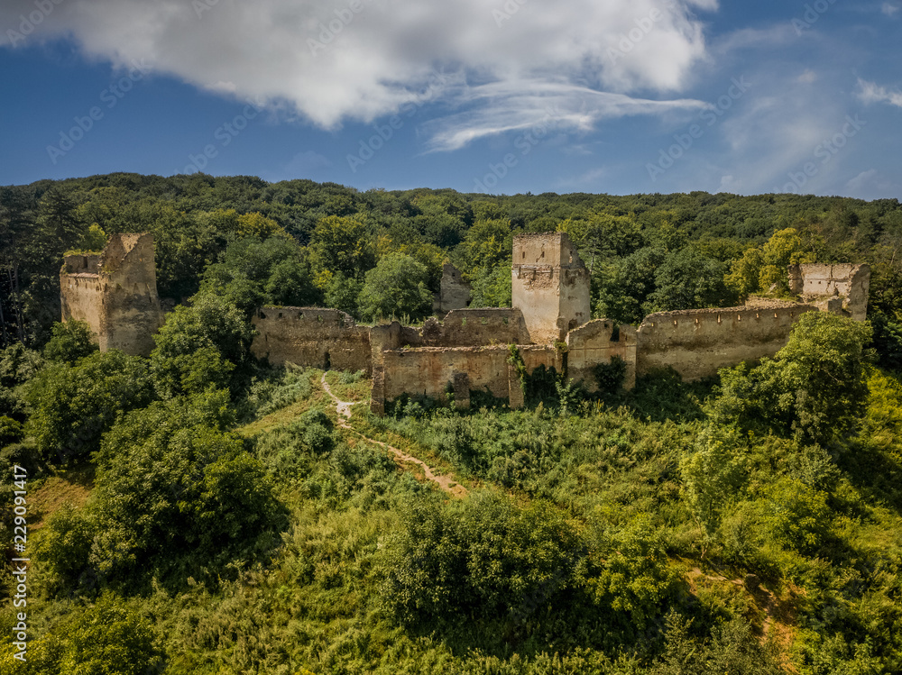 Aerial view of Saschiz Szaszkezd castle and medieval Saxon village in Transylvania Romania