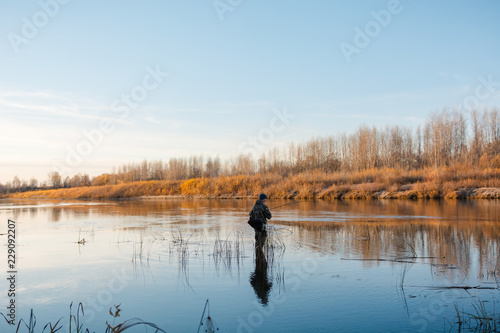 Fisherman in the fall. Fisherman in Siberia.