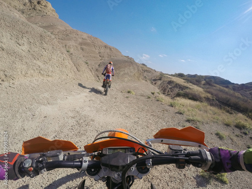 Enduro journey with dirt bike in high mountains in Caucasus nature