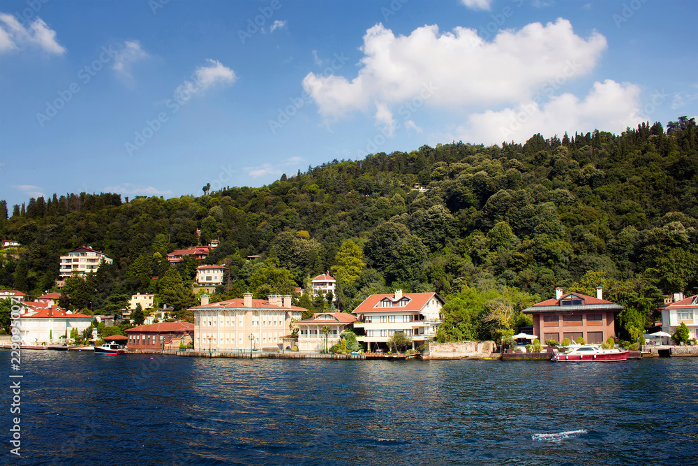 View of houses by Bosphorus on Asian side of Istanbul. It is a sunny summer day. View of houses by Bosphorus on Asian side of Istanbul. It is a sunny summer day.
