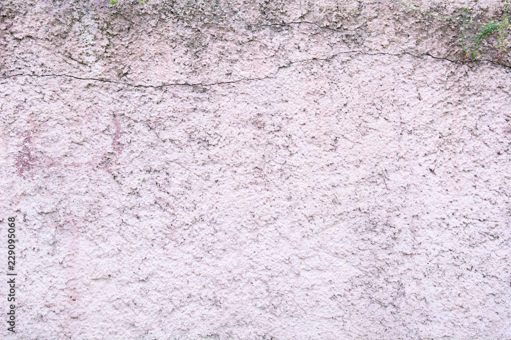 Rose color plaster on the wall closeup texture background, cement surface on the wall