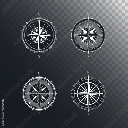 Vector set of vintage compasses or marine wind roses. Collection in line art style. Isolated on dark transparent background. Withe line collection with the basic directions North and South.