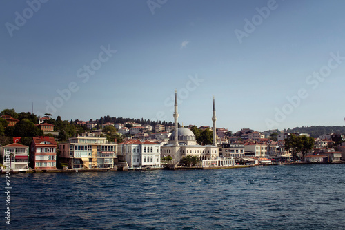 View of houses, mosque and buildings by Bosphorus on the Asian side of Istanbul. It is a sunny summer day.