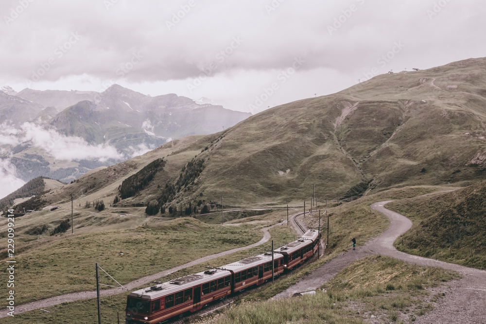 View on mountains from Jungfraujoch staion in alps, Lauterbrunnen, Switzerland, Europe. Summer landscape, rainy weather, dramatic clouds sky