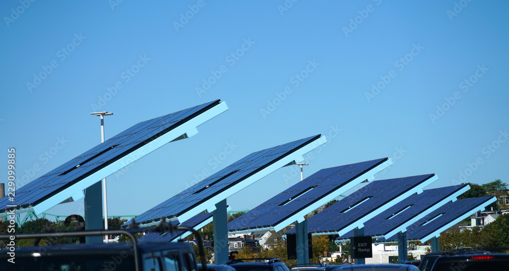 arrayed solar panels in a row in the parking lots