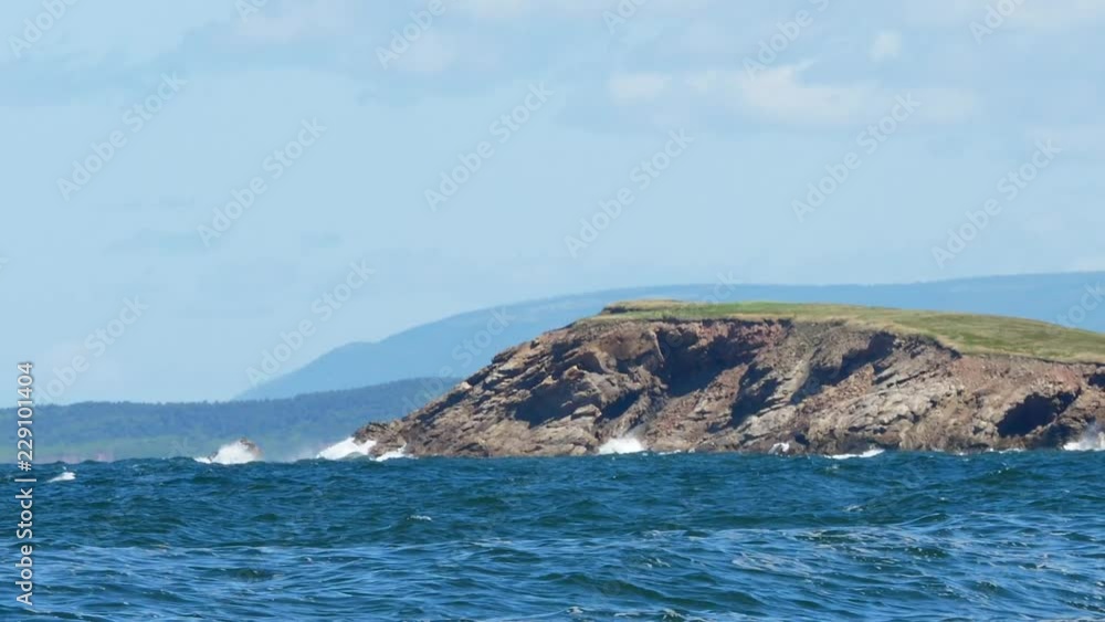 Slow Motion Waves Splash Along The Ocean Coast Over Rugged Rocks Slow Motion Waves Splash Along The Ocean Coast Over Rugged Rocks