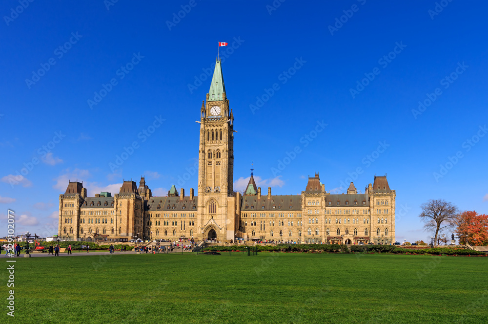 Parliament Hill, Ottawa, Canada, the center block and the Peace Tower. A view of the front facade of Canadian parliament tower. Parliament Hill, Ottawa, Canada, the center block and the Peace Tower. A view of the front facade of Canadian parliament tower.