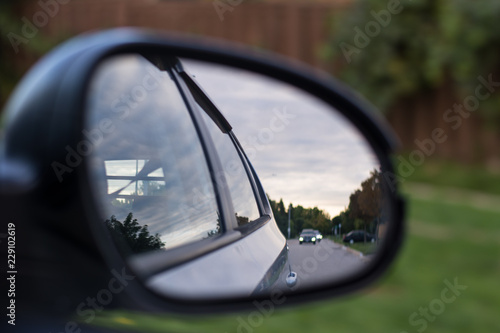 View of the road in a side mirror