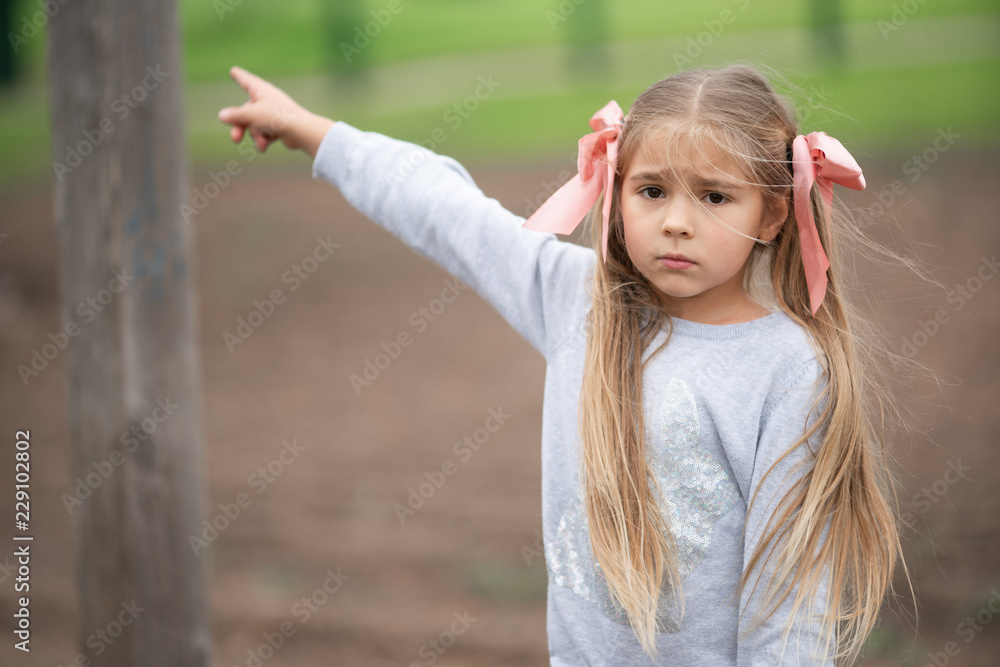 Happy child has fun on a rope eco playground Happy child has fun on a rope eco playground