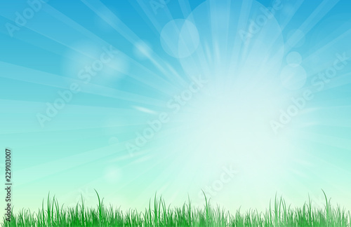 Abstract Blue sky blurred gradient background. Nature blurred bokeh background with sunlight and grass. © Go Ahead