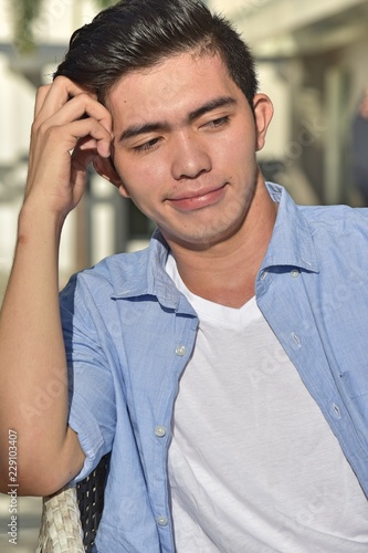 Young Filipino Male Deciding