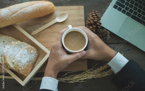 Businessman with coffee and breakfast.