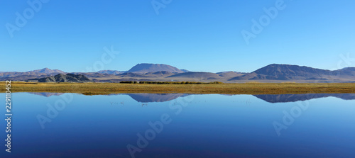 Reflection of lake after beautiful mountain with blue sky of Western Mongolia. Natural background  © isarescheewin